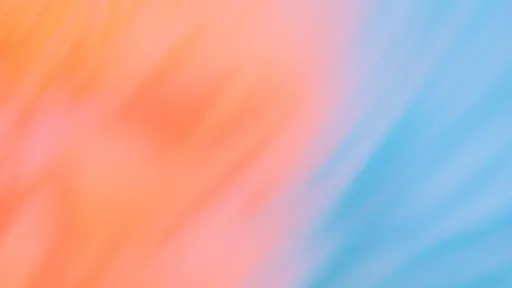 Blurred gradient with pastel orange and blue hues.