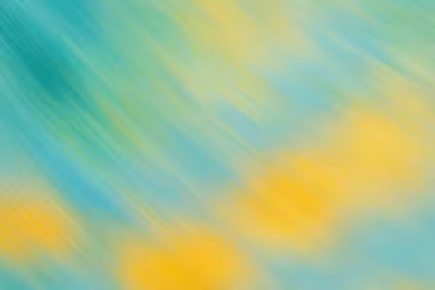 Gradient of blue and yellow brushstrokes creating a blurred texture.